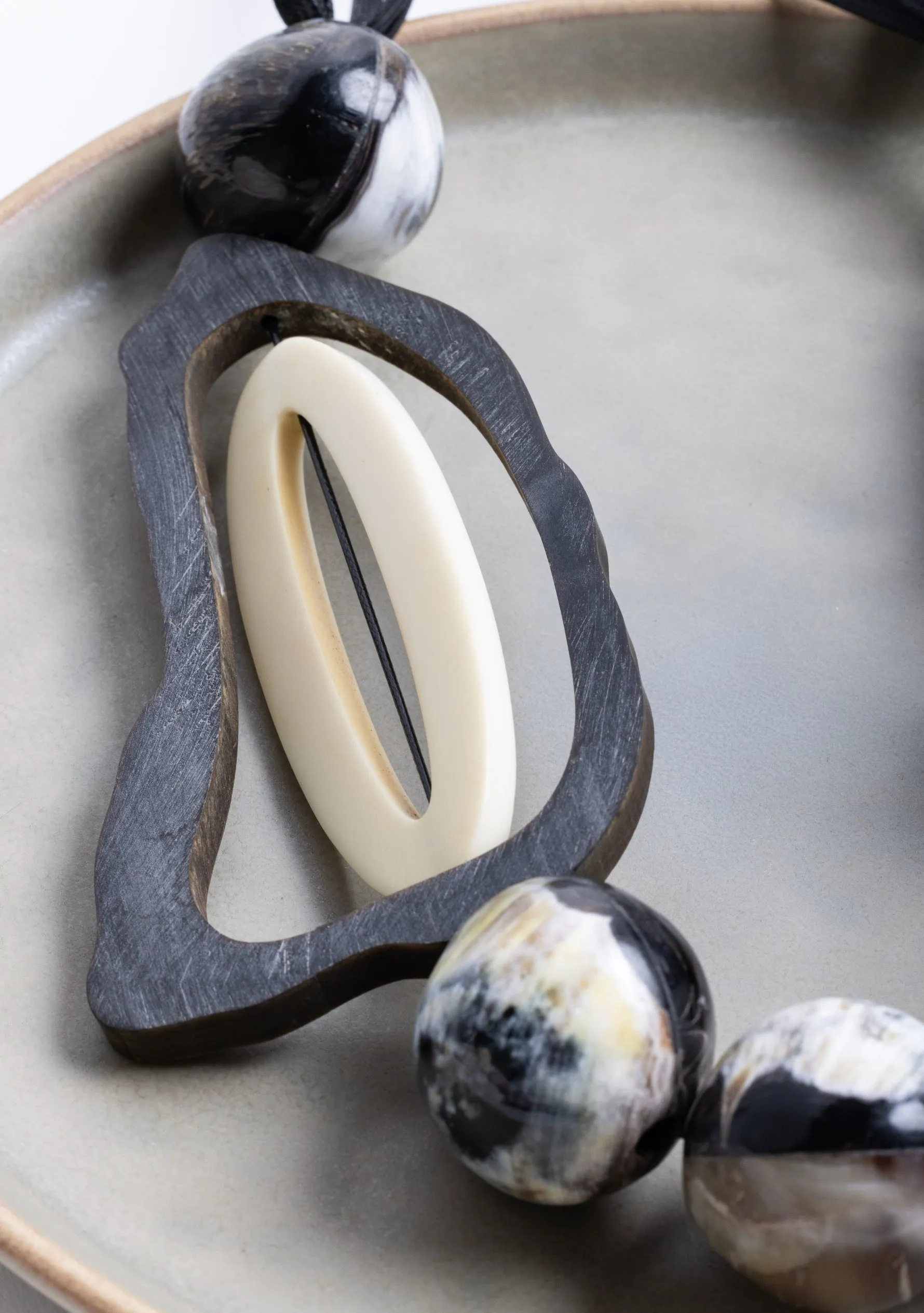 Black Cord Necklace with Black-Natural Buffalo Horn Balls and a White Resin "0"